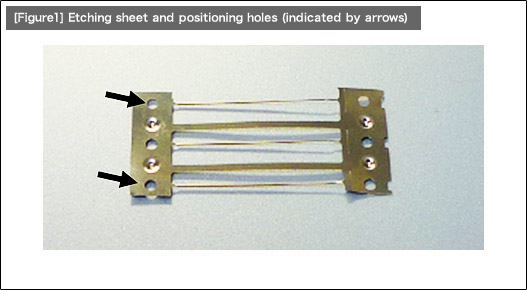 [Figure1] Etching sheet and positioning holes (indicated by arrows)