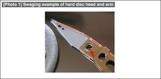 [Photo 1] Swaging example of hard disc head and arm
